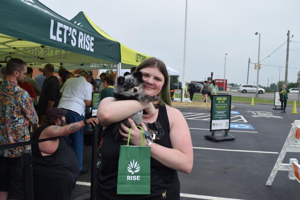 Brittnay Smith, a medical marijuana user from Hagerstown, waits at RISE Dispensary on Wesel Boulevard on Saturday morning, the first day recreational marijuana sales were legal in Maryland.