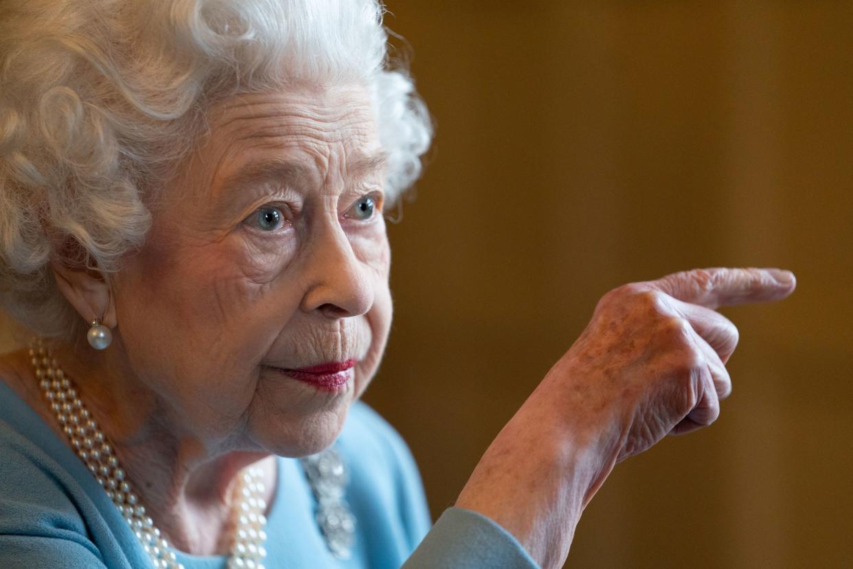 Britain's Queen Elizabeth gestures during a reception with representatives from local community groups to celebrate the start of the Platinum Jubilee, at the Ballroom of Sandringham House, which is the Queen's Norfolk residence, in Sandringham, Britain, February 5, 2022. Joe Giddens/Pool via REUTERS