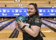 Maria Bulanova, a member of the Professional Women's Bowling Association and an assistant bowling coach at St. Francis College poses for a portrait before practice at Kingpin's Alley and Family Center, Wednesday, June 15, 2022, in Glens Falls, N.Y. Title IX has opened the door for thousands of female athletes from abroad to get an American education and a shot at a life and career in the United States. (AP Photo/Hans Pennink)