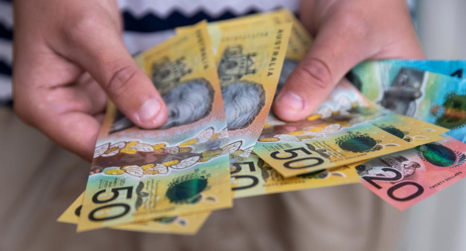 Person hold Australian money notes. Cash.