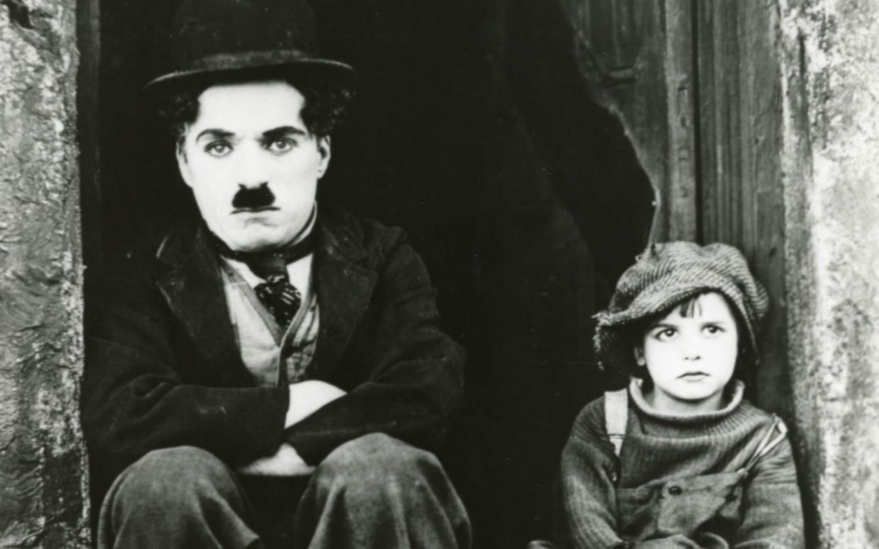 Charlie Chaplin and Jackie Coogan in The Kid - API