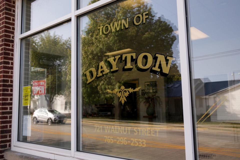 Main Street is reflected in the windows of the Dayton town hall, Monday, Sept. 21, 2020 in Dayton.