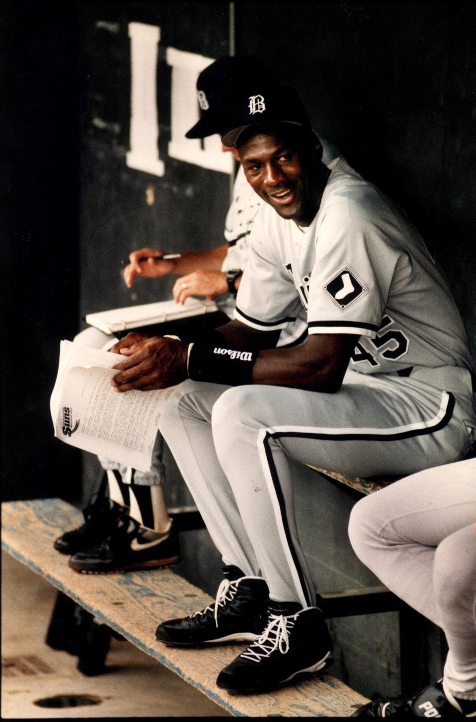 Michael Jordan relaxes in the Birmingham Barons dugout during his minor-league baseball appearnce at Wolfson Park in Jacksonville. He didn't play that day, disappointing fans who flocked to the stadium to see him.