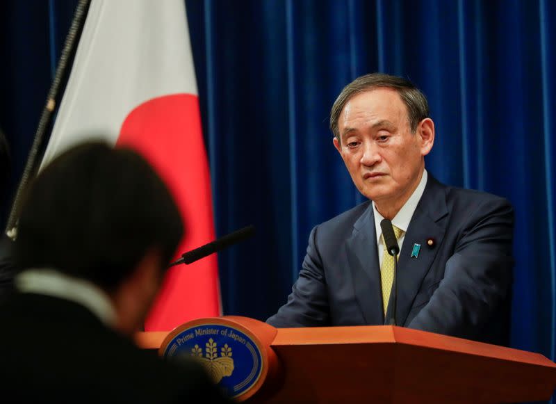 Japanese Prime Minister Yoshihide Suga speaks during a news conference in Tokyo