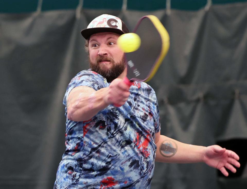 Jason Verhoosky returns a backhand during the Brown Billone Club Pickleball Classic in Easton on Saturday, Feb. 18, 2023.