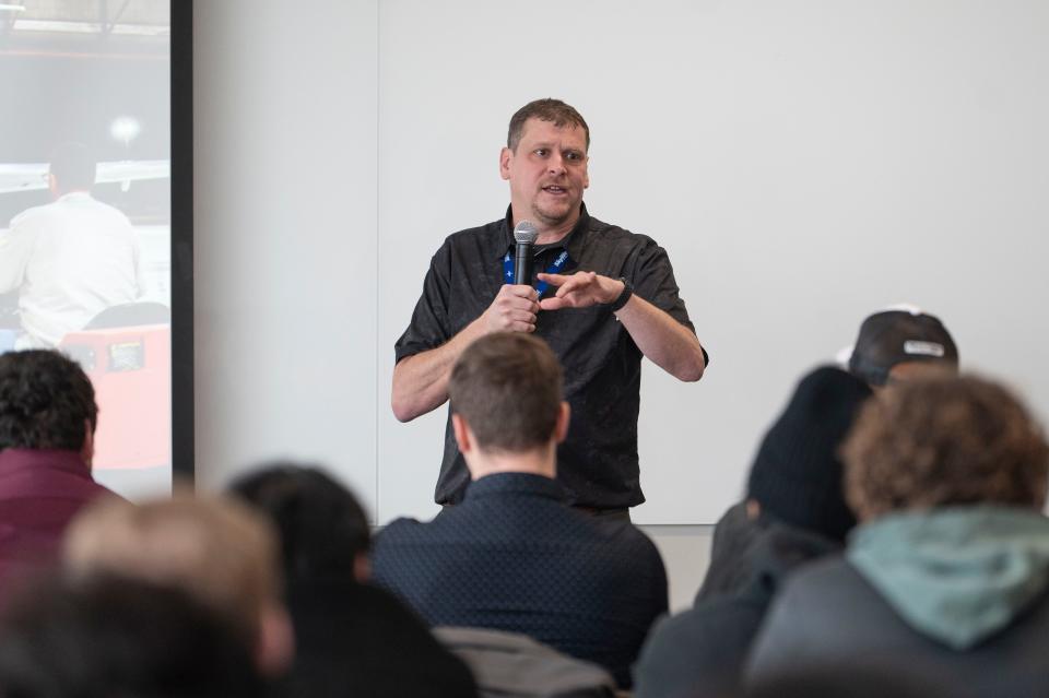 SkyWest Aircraft Maintenance Technician Michael LaFollette answers students' questions regarding the AMT Pathway program at Western Michigan University's College of Aviation in Battle Creek on Monday, Jan. 23, 2023.