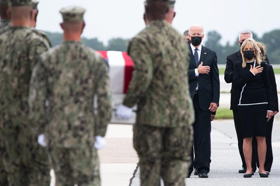 US President Joe Biden and US First Lady Jill Biden, and other officials, attends the dignified transfer of the remains of fallen service members at Dover Air Force Base in Dover, Delaware, August, 29, 2021.