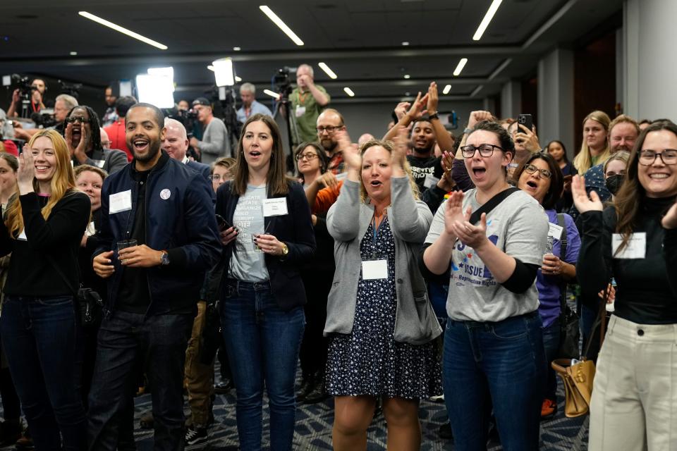 Supporters of Issue 1 react during a gathering for the issue at the Hyatt Regency Downtown. The issue establishes a constitutional right to abortion.