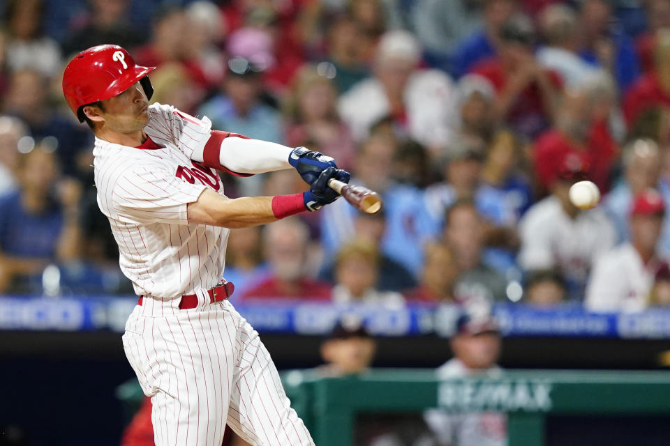 Philadelphia Phillies' Dalton Guthrie hits a run-scoring single against Washington Nationals pitcher Patrick Corbin during the third inning of a baseball game, Friday, Sept. 9, 2022, in Philadelphia. (AP Photo/Matt Slocum)