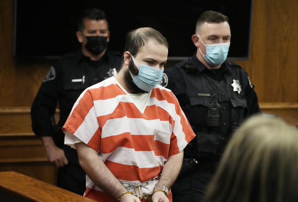 FILE - Ahmad Al Aliwi Alissa, accused of killing 10 people at a Colorado supermarket in March 2021, is led into a courtroom for a hearing, Sept. 7, 2021, in Boulder, Colo. Attorneys will begin arguments Wednesday, Sept. 27, 2023, over whether Al Aliwi Alissa is mentally competent to proceed toward trial for the mass shooting. (AP Photo/David Zalubowski, Pool, File)