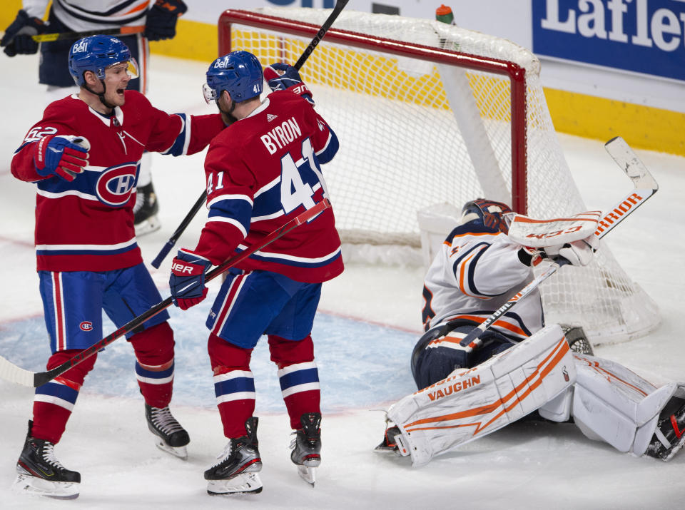 Montreal Canadiens' Paul Byron (41) celebrates with teammate Artturi Lehkonen (62) after scoring the second goal against Edmonton Oilers goaltender Mikko Koskinen (19) during second-period NHL hockey game action in Montreal, Monday, May 10, 2021. (Ryan Remiorz/The Canadian Press via AP)