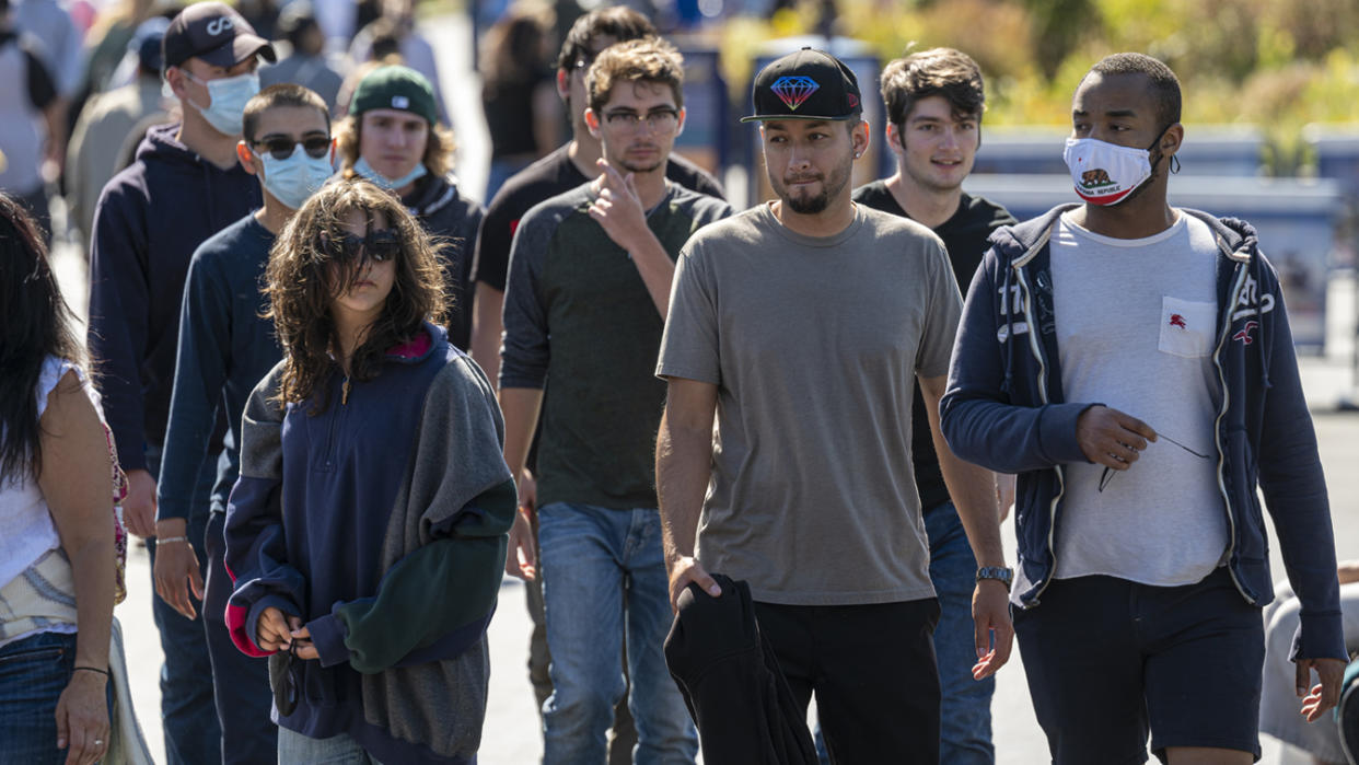 People walk on Fishermans Wharf in San Francisco, California, U.S. on Tuesday, June 15, 2021. (David Paul Morris/Bloomberg via Getty Images)