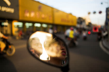 Huang Wensi and her husband Deng Peipeng spend time in their hometown in Lianjiang, Guangdong province, China, June 30, 2018. REUTERS/Yue Wu