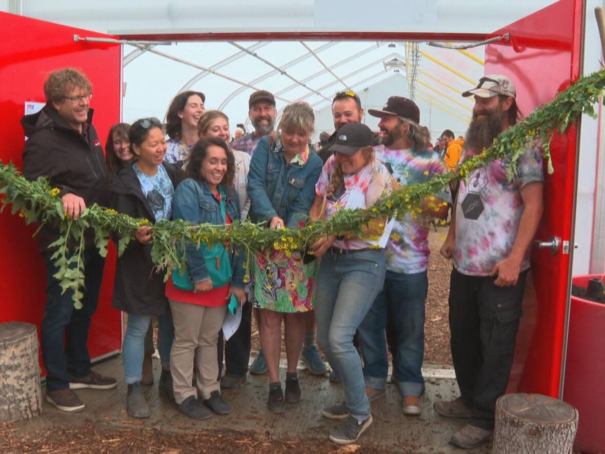 Highfield Farm celebrates the completion of its first greenhouse build.  (Helen Pike/CBC - image credit)