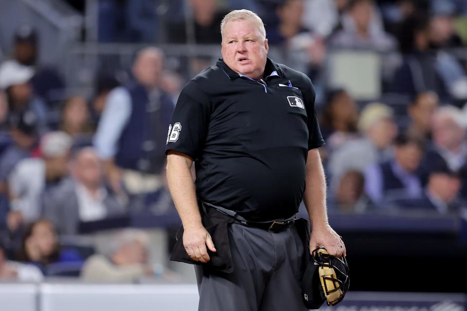 Home plate umpire Bill Miller looks towards the New York Yankees dugout during the fourth inning against the Toronto Blue Jays at Yankee Stadium.