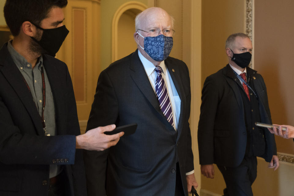 Sen. Patrick Leahy, D-Vt., walks with reporters, Tuesday, Jan. 26, 2021, as he leaves the Senate floor on Capitol Hill in Washington. (AP Photo/Jacquelyn Martin)