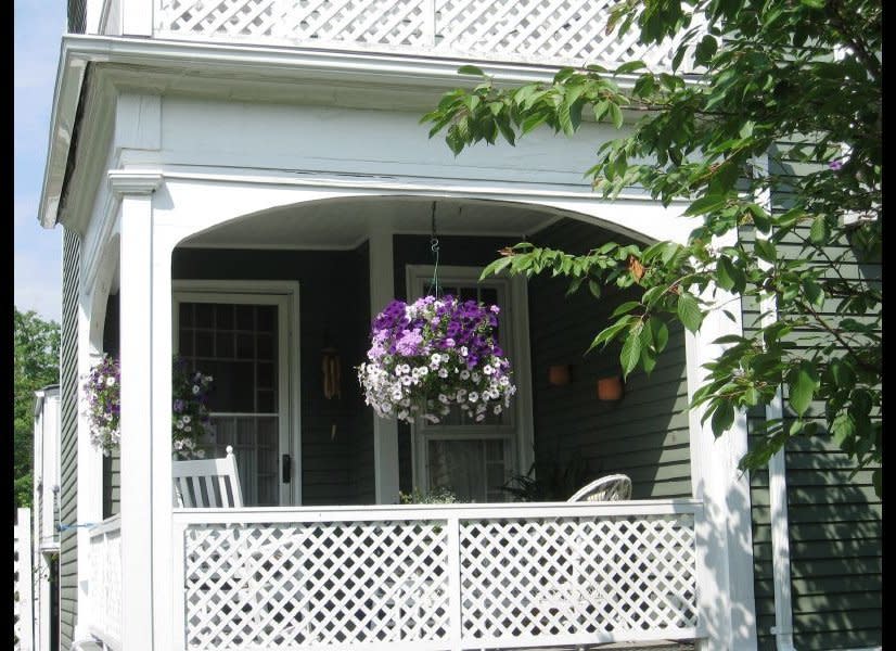 Though this is tiny, the owners make great use of the space with chairs and the hanging flower basket adds just the right amount of color.     Photo by Flickr user <a href="http://www.flickr.com/photos/garylerude/2609129368/" target="_hplink">Gary Lerude. </a>