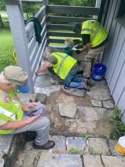 Broken flagstones, which used to line the entrances to a small comfort station at Craggy picnic grounds, have been reinstalled with new mortar. This was one of many projects workers undertook to renovate the area.
