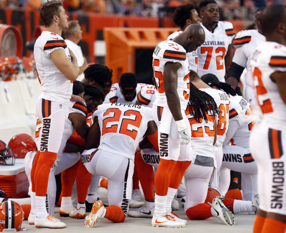 Cleveland Browns players kneel during a recent anthem. (AP)