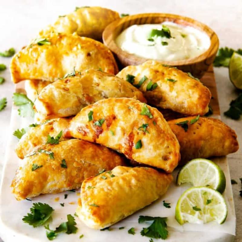 <p>Real Housemoms</p><p>Stuffed with chicken, black beans, bell peppers and cheese.</p><p><strong>Get the recipe: </strong><a href="https://realhousemoms.com/mexican-chicken-empanadas/" rel="nofollow noopener" target="_blank" data-ylk="slk:Mexican Chicken Empanadas;elm:context_link;itc:0;sec:content-canvas" class="link rapid-noclick-resp">Mexican Chicken Empanadas</a></p>