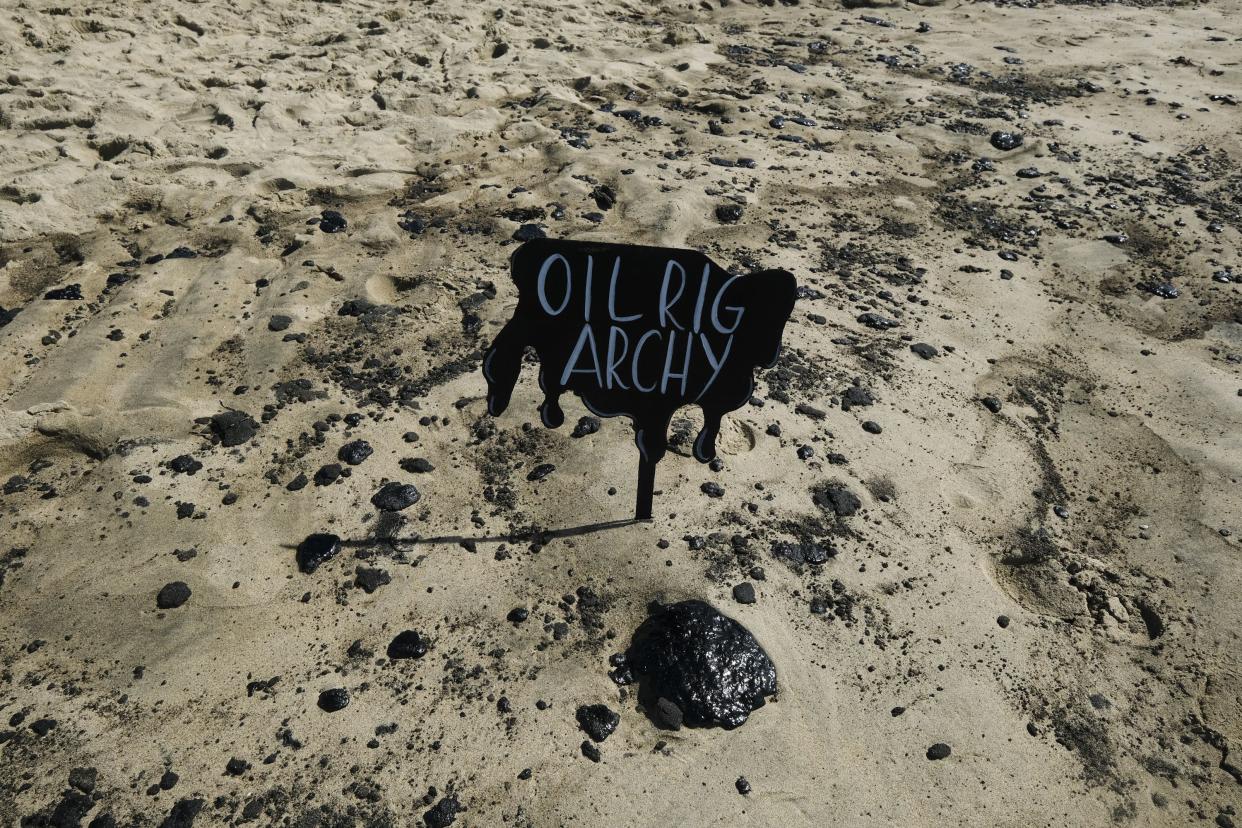 Oil washed up on Huntington Beach, Calif., on Sunday., Oct. 3, 2021.