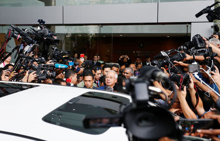 Malaysia's former prime minister Najib Razak (C) speaks to journalists as he leaves after giving a statement to the Malaysian Anti-Corruption Commission (MACC) in Putrajaya, Malaysia May 22, 2018. REUTERS/Lai Seng Sin