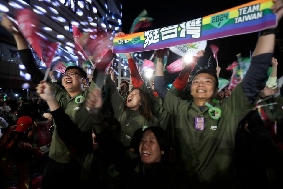 Supporters of Lai Ching-te celebrate his election victory (AP)