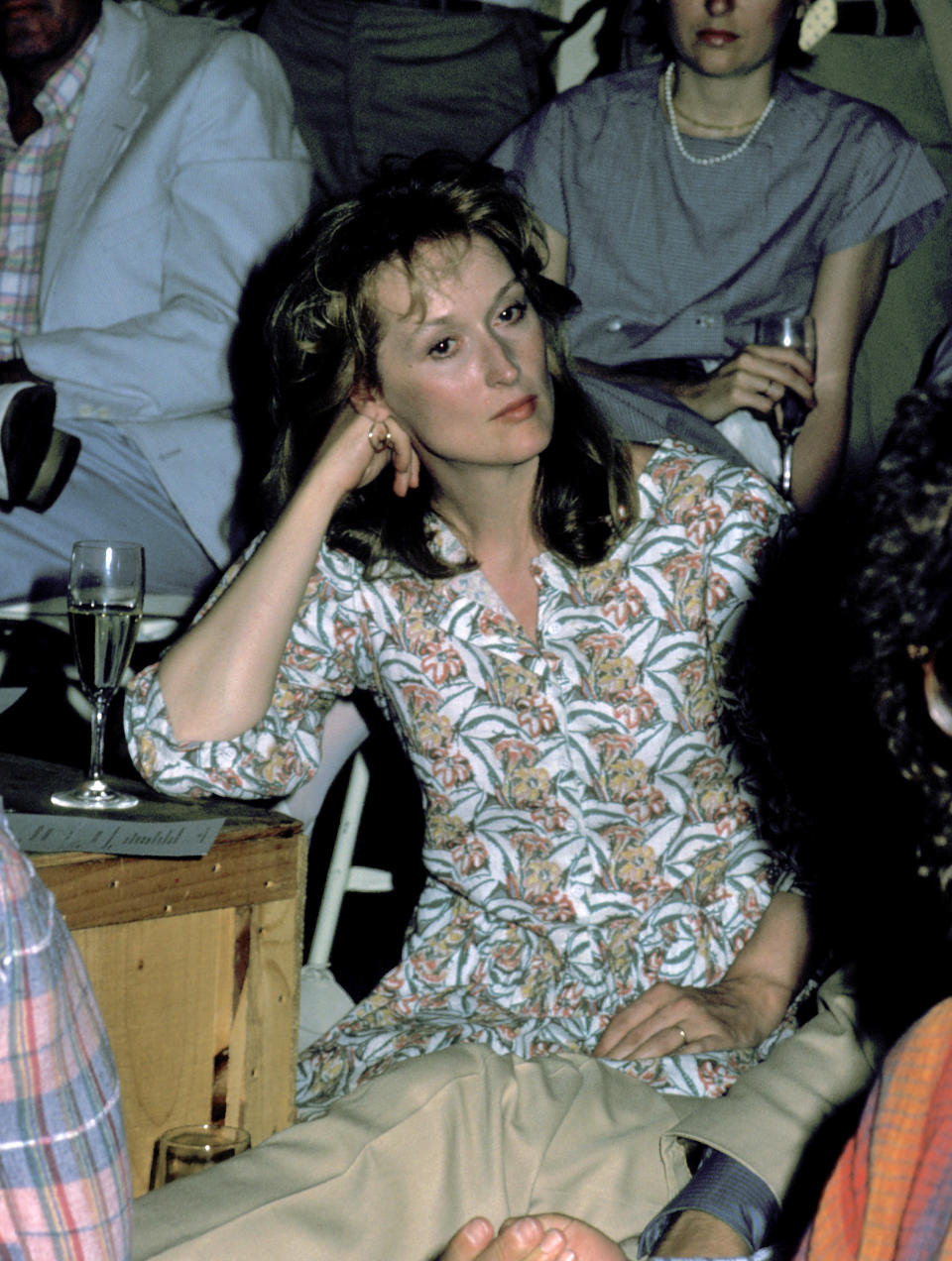 Meryl with long hair in a print top