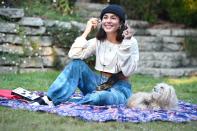 <p>Vanessa Hudgens hangs out in the park with her pup on Thursday in L.A. </p>