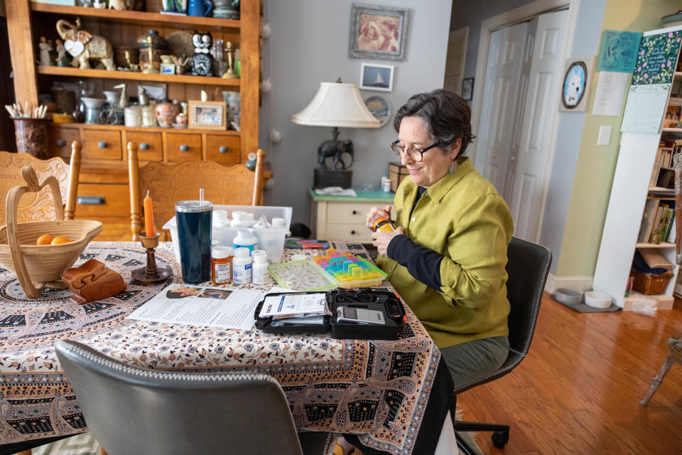 Monday, February 26, 2024; Port Royal, SC; Galen Warden spends about an hour a week organizing all of the medications that her son James Strazza has to take each day to help give him some relief from myalgic encephalomyelitis, or chronic fatigue syndrome that he suffers from.