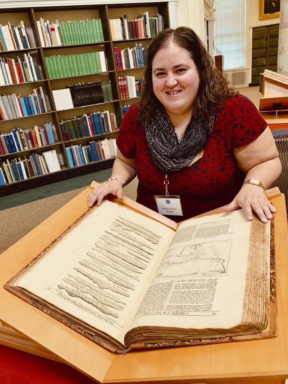 This May 2019 photo provided by Ben Bascom shows Jamie Bolker while doing research at the American Antiquarian Society in Worcester, Mass. When Bolker started teaching composition at MacMurray College in January 2020, she felt like she'd won the lottery. In March, though, she delivered a grim Twitter announcement: “Welp. MacMurray College is permanently closing ... They were already on the edge and coronavirus was the final nail.” (Ben Bascom via AP)