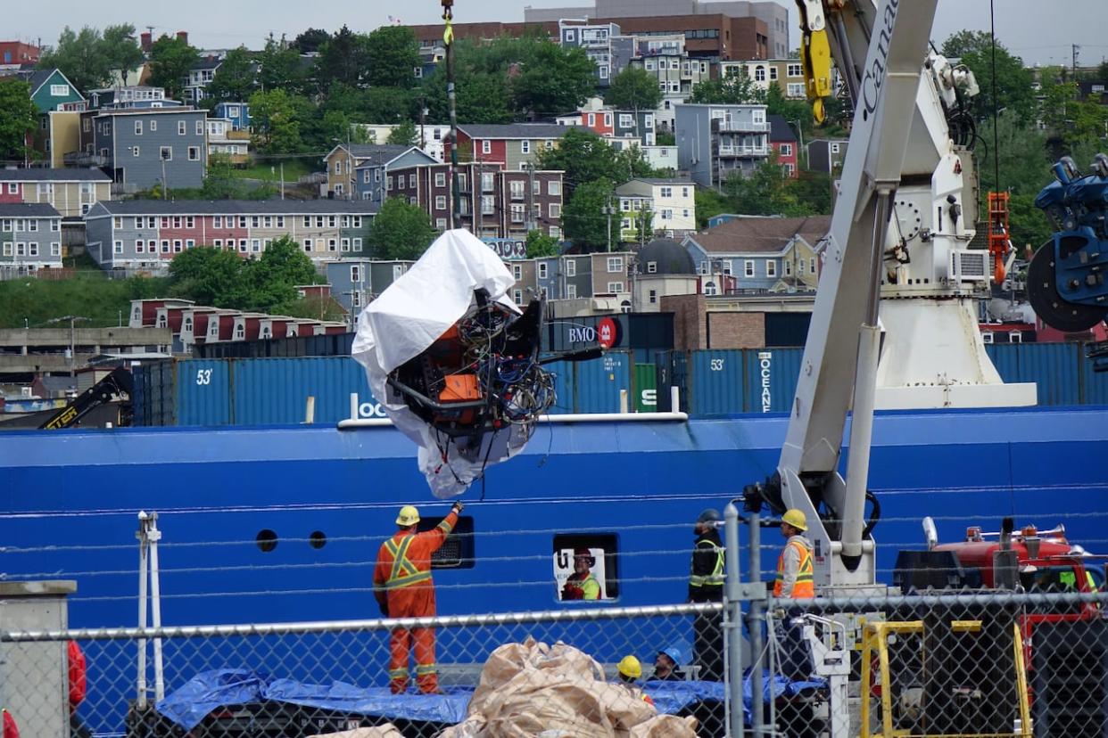 Wreckage from the Titan is hoisted from the ship that brought it back to St. John's harbour Wednesday morning.