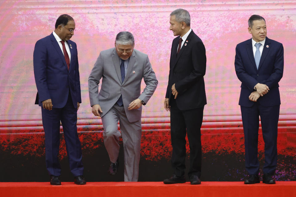 From left, Malaysia's Foreign Minister Zambry Abd Kadir, Philippines' Foreign Secretary Enrique Manalo, Singapore's Foreign Minister Vivian Balakrishnan and Thailand's Permanent Secretary of the Ministry of Foreign Affairs Sarun Charoensuwan, take their spots on the stage for a family photo session during the 34th Association of Southeast Asian Nations (ASEAN) Coordinating Council (ACC) meeting, ahead of the ASEAN Summit, at the ASEAN Secretariat in Jakarta, Indonesia, Monday, Sept. 4, 2023. (Willy Kurniawan/Pool Photo via AP)