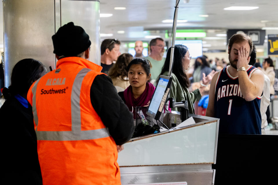 Southwest Airlines travelers wait in line for assistance with lost luggage at the William P. Hobby Airport on December 28, 2022 in Houston. (Photo by Brandon Bell/Getty Images)