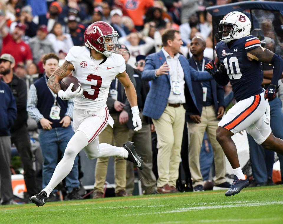 Alabama Crimson Tide wide receiver Jermaine Burton (3) outruns Auburn Tigers safety Zion Puckett (10) for a touchdown at Jordan-Hare Stadium.