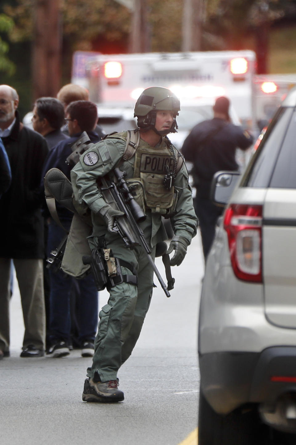 FILE - In this Oct. 27, 2018 file photo, armed police move through the streets of the Squirrel Hill neighborhood of Pittsburgh where a shooter opened fire and 11 people were killed in America's deadliest antisemitic attack at the Tree of Life Synagogue. As the three-year mark since the massacre at the Tree of Life synagogue approaches, survivors are planning now-familiar annual rituals of remembrance, the criminal case involving the suspect plods on and the massacre site is in line for restoration. (AP Photo/Keith Srakocic, File)