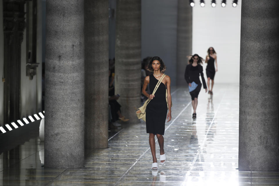 A model wears a creation as part of the Bottega Veneta Spring-Summer 2020 collection, unveiled during the fashion week, in Milan, Italy, Thursday, Sept. 19, 2019. (AP Photo/Antonio Calanni)