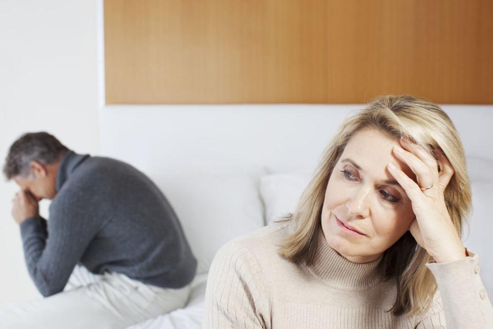 what to do after a fight husband and wife sitting at different ends of the bed