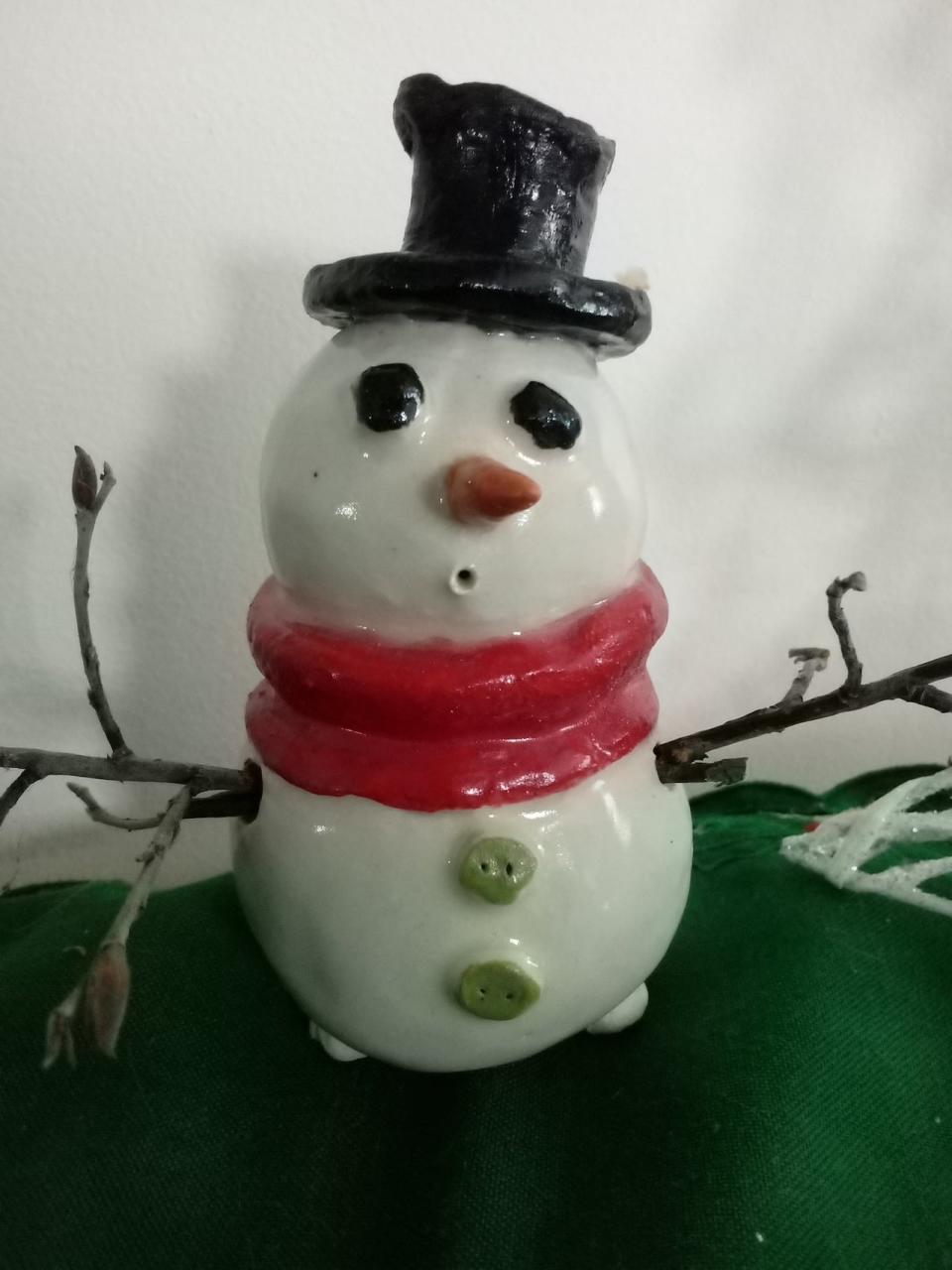 Seniors have been creating a variety of pottery projects. One of them is a snowman created using pinch pots. 