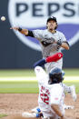 Chicago White Sox second baseman Nicky Lopez (8) forces out Cleveland Guardians' Josh Naylor (22) at second base and throws out Tyler Freeman at first base to complete the double play during the fifth inning of a baseball game, Monday, April 8, 2024, in Cleveland. (AP Photo/Ron Schwane)