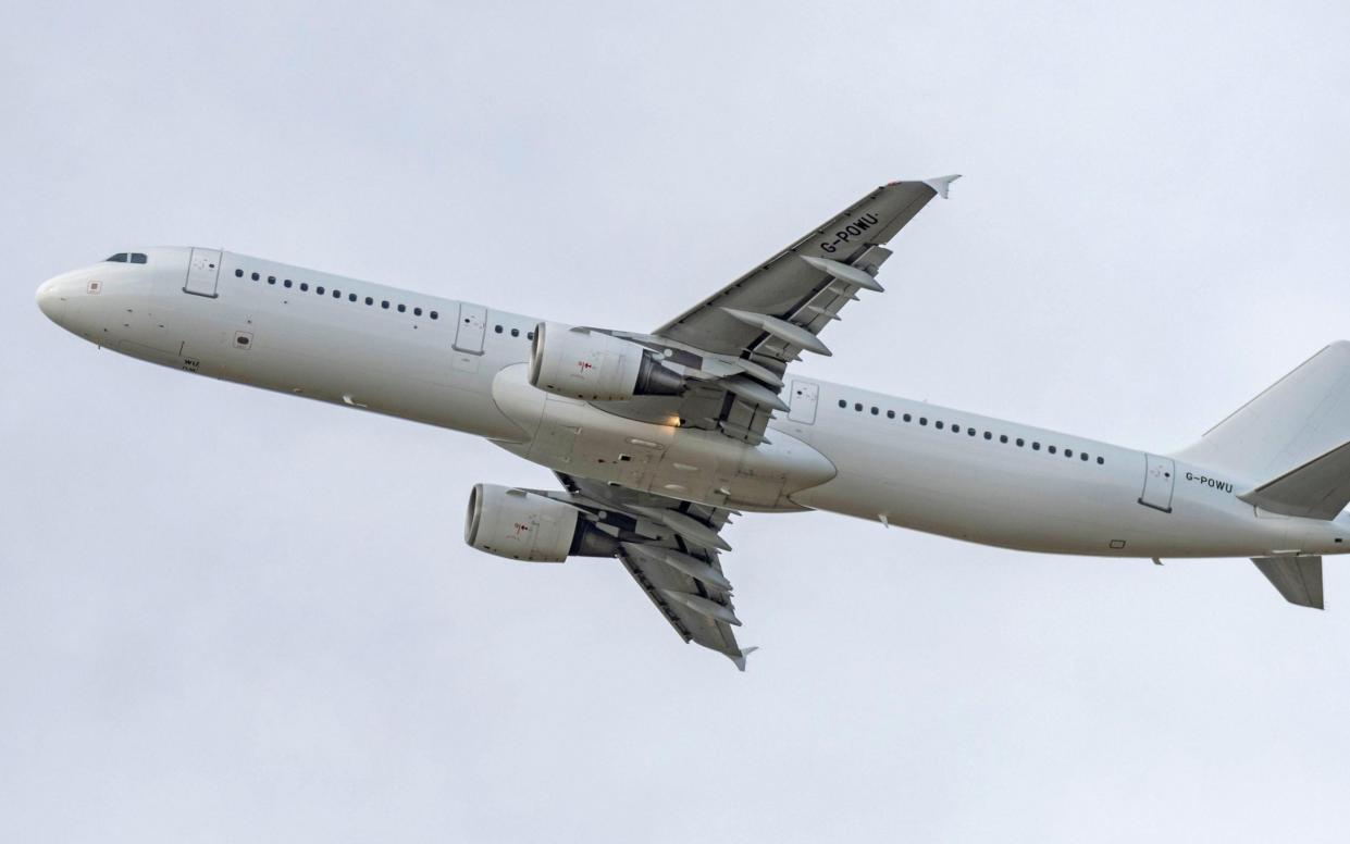 Titan Airways Airbus A321, GPOWU, departing from Manchester Airport - Alamy 