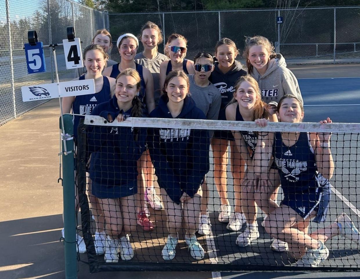 Members of the Exeter High School girls tennis team are all smiles after Monday's 5-4 win over Dover. It was the first regular-season loss for Dover since 2019.