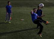 Members of Malaysia's under-13 National Football Development Programme take part in a training session in Kuala Lumpur, Malaysia, in this picture taken January 25, 2016. REUTERS/Olivia Harris