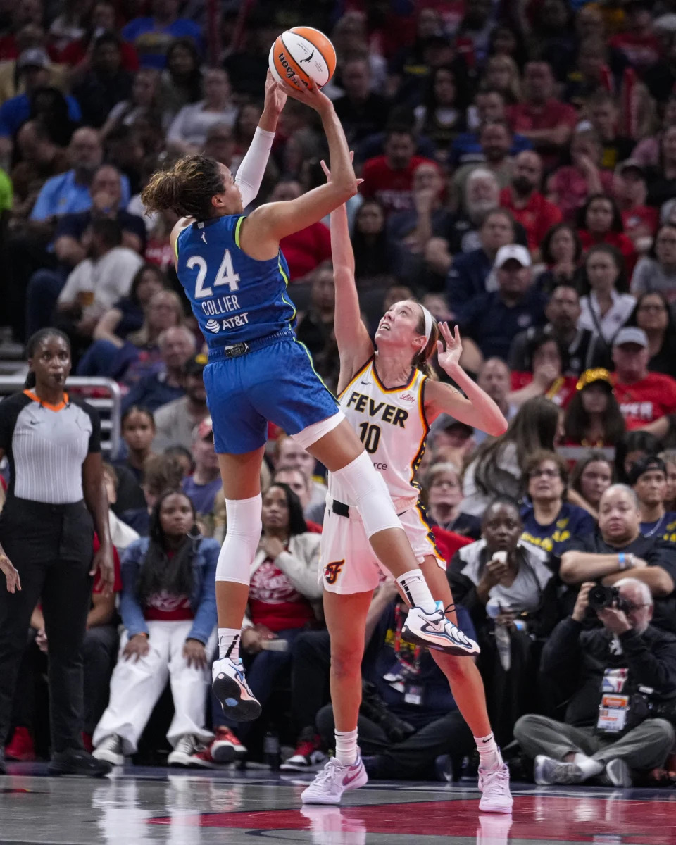 Minnesota Lynx forward Napheesa Collier (24) shoots over Indiana Fever guard Lexie Hull (10) in the second half of a WNBA basketball game in Indianapolis, Friday, Sept. 6, 2024. (AP Photo/Michael Conroy)