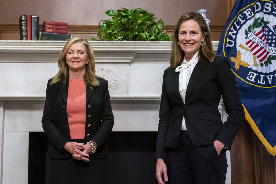 Judge Amy Coney Barrett, President Donald Trumps nominee for the U.S. Supreme Court, meets with Sen. Marsha Blackburn, R-Tenn., on Capitol Hill in Washington, Thursday, Oct. 1, 2020. (Jim Lo Scalzo/Pool via AP)