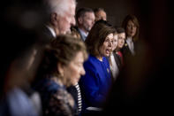 House Speaker Nancy Pelosi of Calif., accompanied by House Congress members, speaks at a news conference to discuss the United States Mexico Canada Agreement (USMCA) trade agreement, Tuesday, Dec. 10, 2019, on Capitol Hill in Washington. (AP Photo/Andrew Harnik)