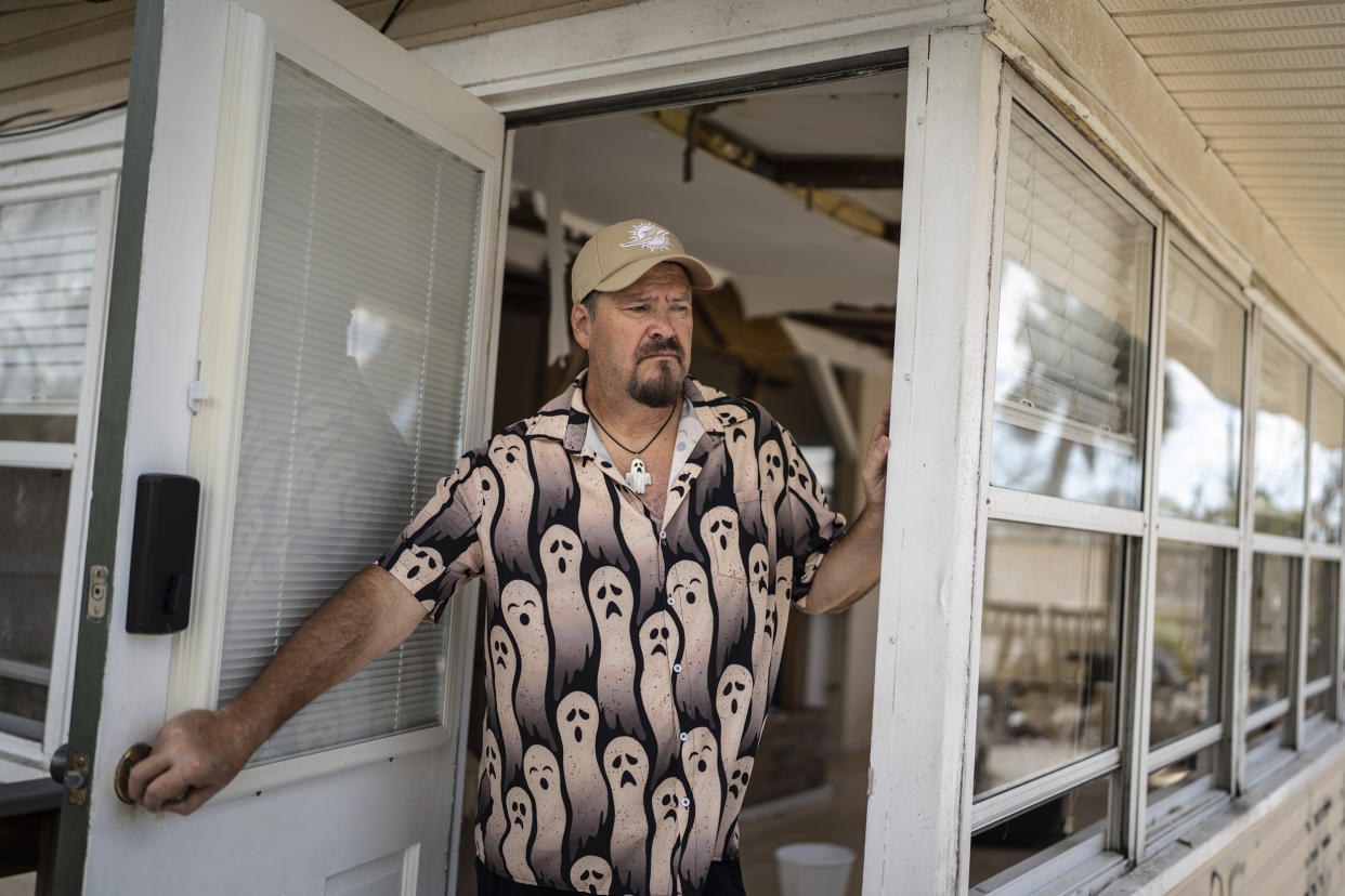 Michael Yost at the damaged home he was renting on Fort Myers Beach, Fla. (Thomas Simonetti for NBC News)
