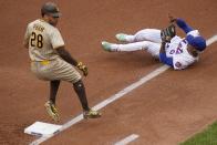 San Diego Padres' Tommy Pham (28) reaches first base for a single as New York Mets starting pitcher Marcus Stroman (0) loses control of the ball during the first inning of a baseball game Saturday, June 12, 2021, in New York. (AP Photo/Frank Franklin II)