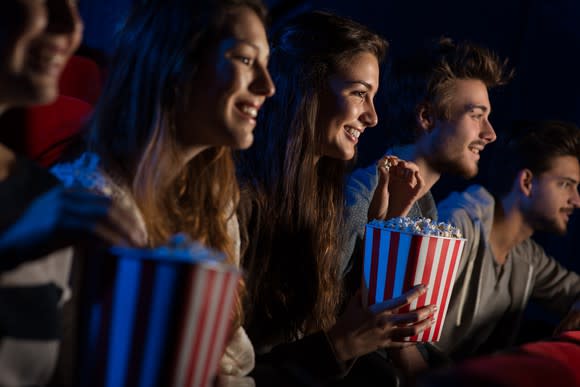 Moviegoers eating popcorn