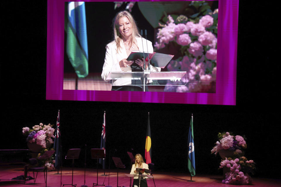 Tessa Humphries, daughter of Australian comedian and actor Barry Humphries, speaks during the State Memorial Service in his honor at the Sydney Opera House in Sydney, Friday, December 15, 2023. King Charles III has paid tribute to the late Barry Humphries at a state memorial service with a message that recalled the monarch's own apprehension when the comedian's alter ego Dame Edna Everage played a prank on him in a royal box a decade ago (David Gray/Pool Photo via AP)